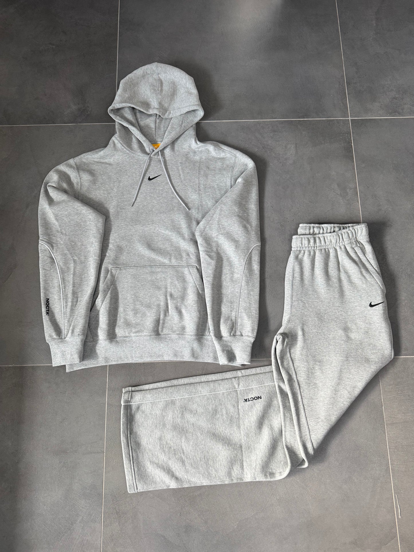 nike nocta tuta completa grigia