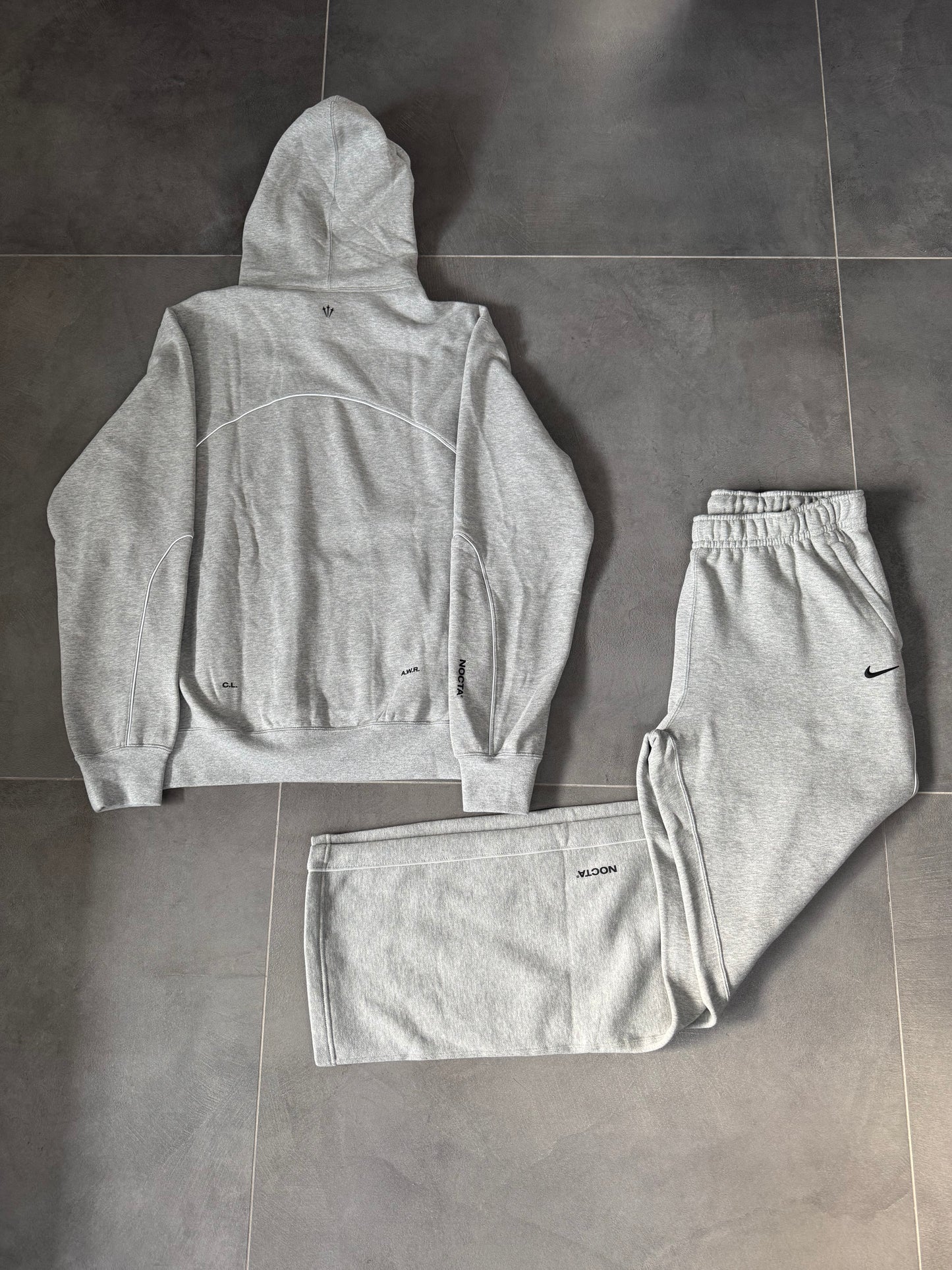 nike nocta tuta completa grigia
